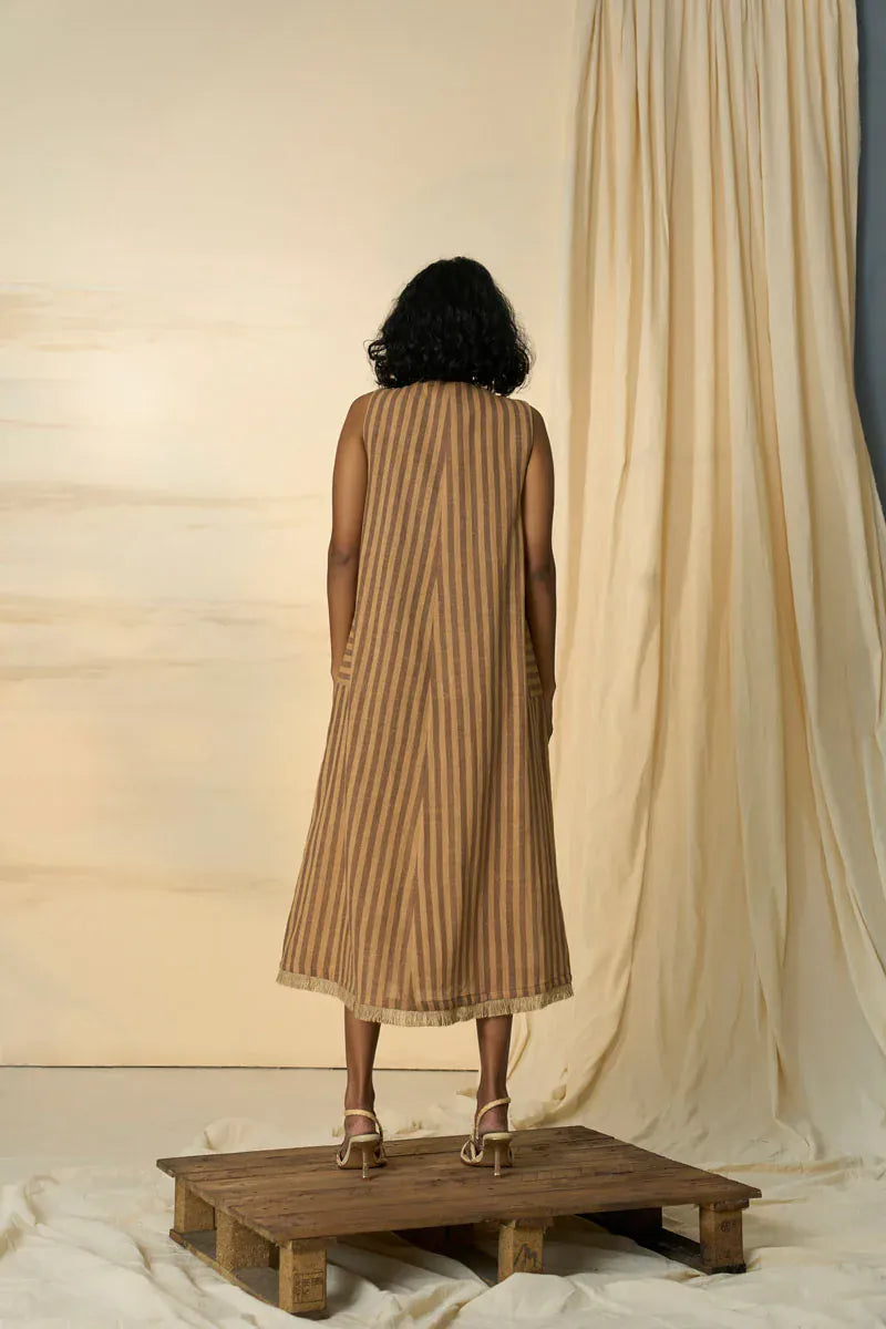 Desert sleeveless maxi dress by Alternative, flowing fabric with a relaxed fit, displayed on a hanger against a neutral background.