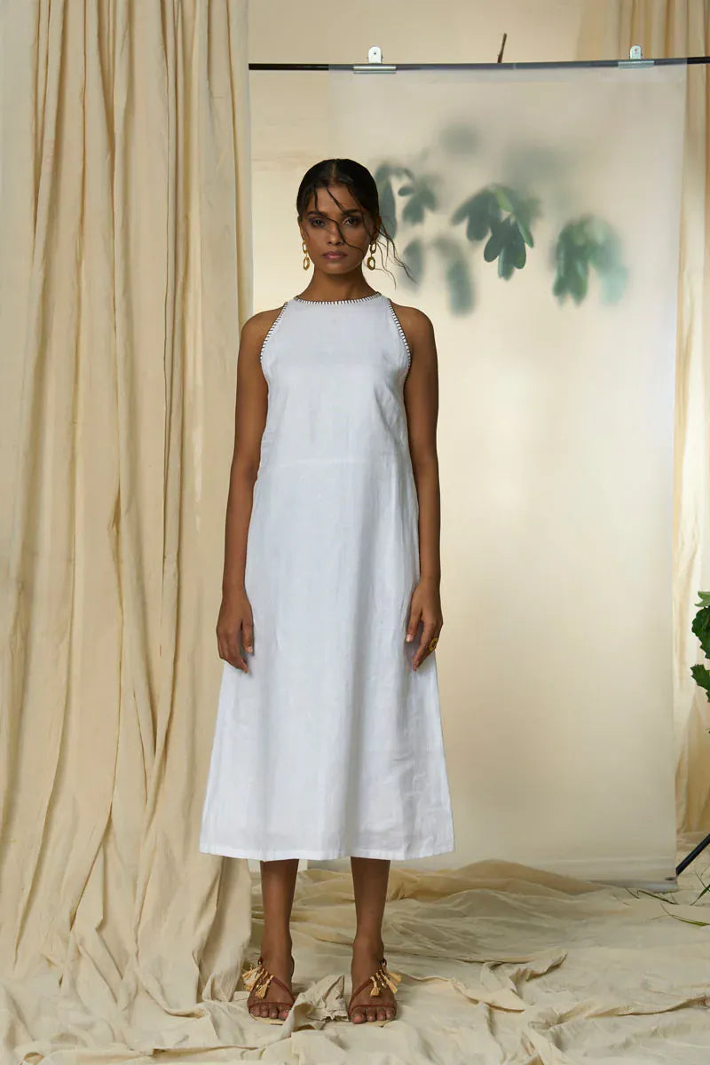 Alternative Manila maxi dress with flowing fabric and floral pattern, displayed on a hanger.