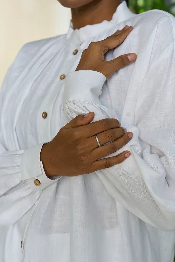 Alternative Manila gathered shirt, a stylish blouse with gathered fabric details, shown in a natural, casual fit on a model.