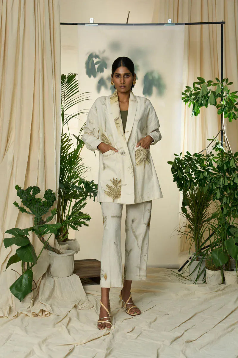 Alternative live leafy overlay jacket featuring a green jacket with leafy print and layered design, shown on a hanger.