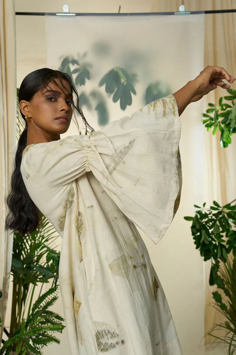 Alternative live leafy smocked maxi dress with a flowing silhouette and leafy print, perfect for casual or summer wear.
