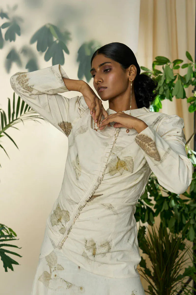 Live leafy pleated maxi dress by Alternative, flowing fabric with a vibrant leafy pattern and elegant pleats.
