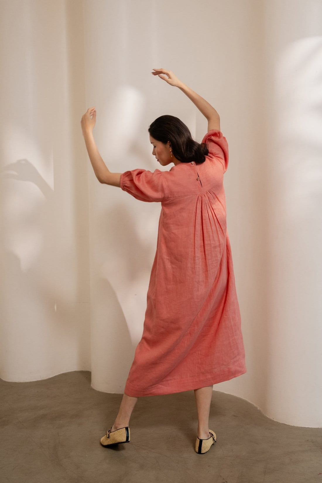 Dawn-orange smocked maxi dress by Alternative featuring a relaxed fit and lightweight fabric, perfect for casual summer wear.
