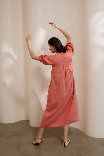 Dawn-orange smocked maxi dress by Alternative featuring a relaxed fit and lightweight fabric, perfect for casual summer wear.