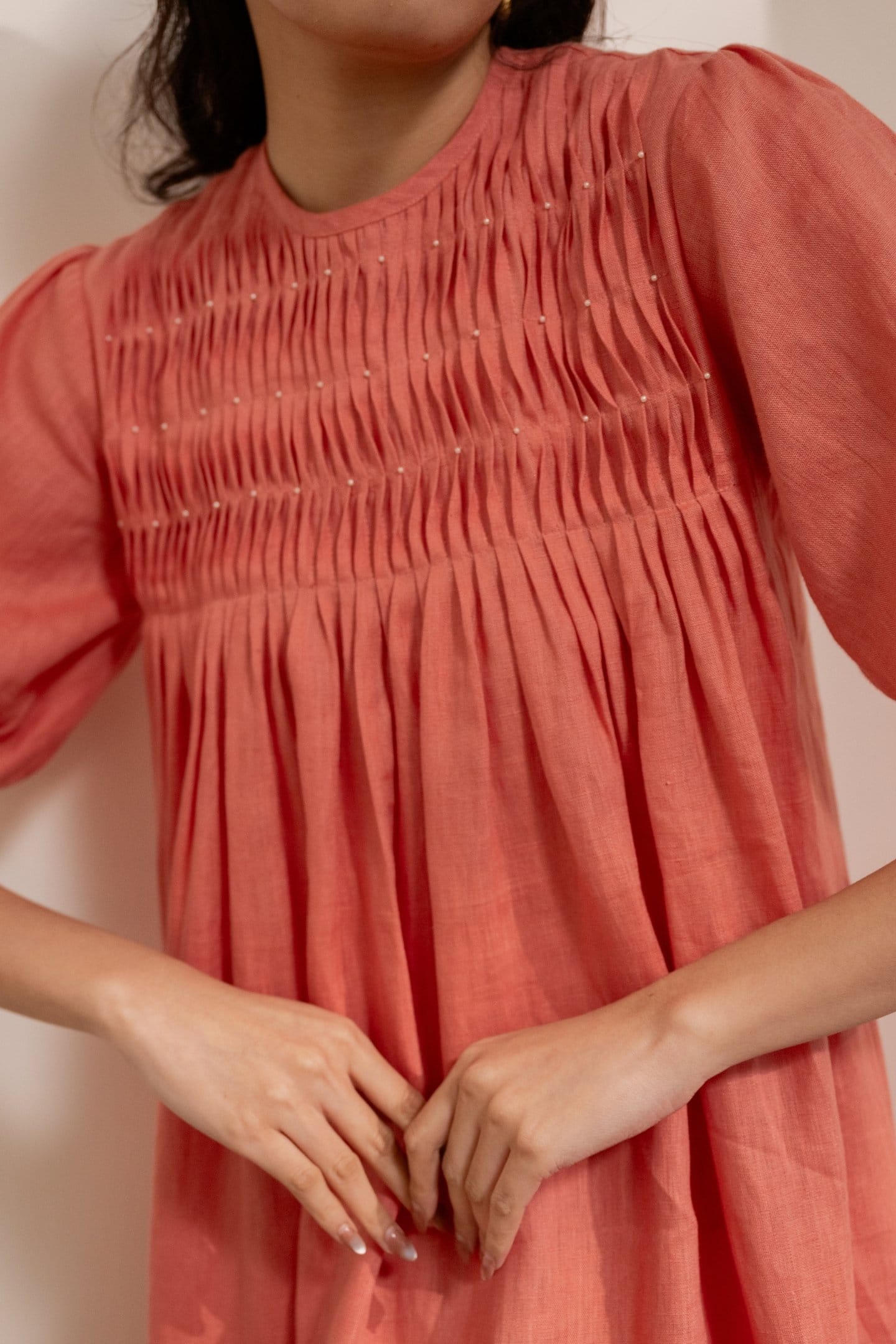 Orange Dawn smocked maxi dress by Alternative, featuring a relaxed fit with smocking details and flowing fabric.