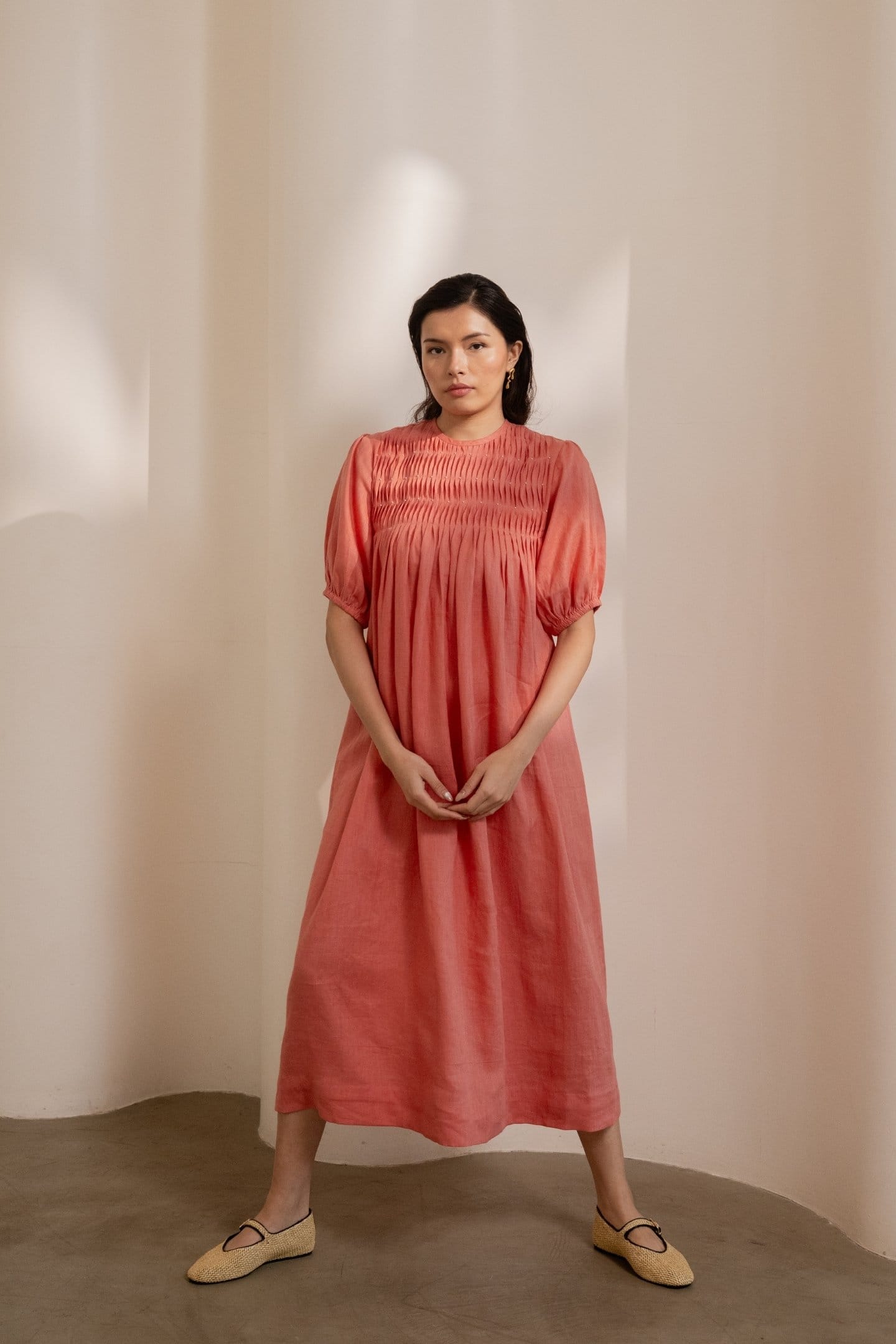 Dawn orange smocked maxi dress by Alternative, flowing fabric with a smocked bodice and ankle-length skirt.