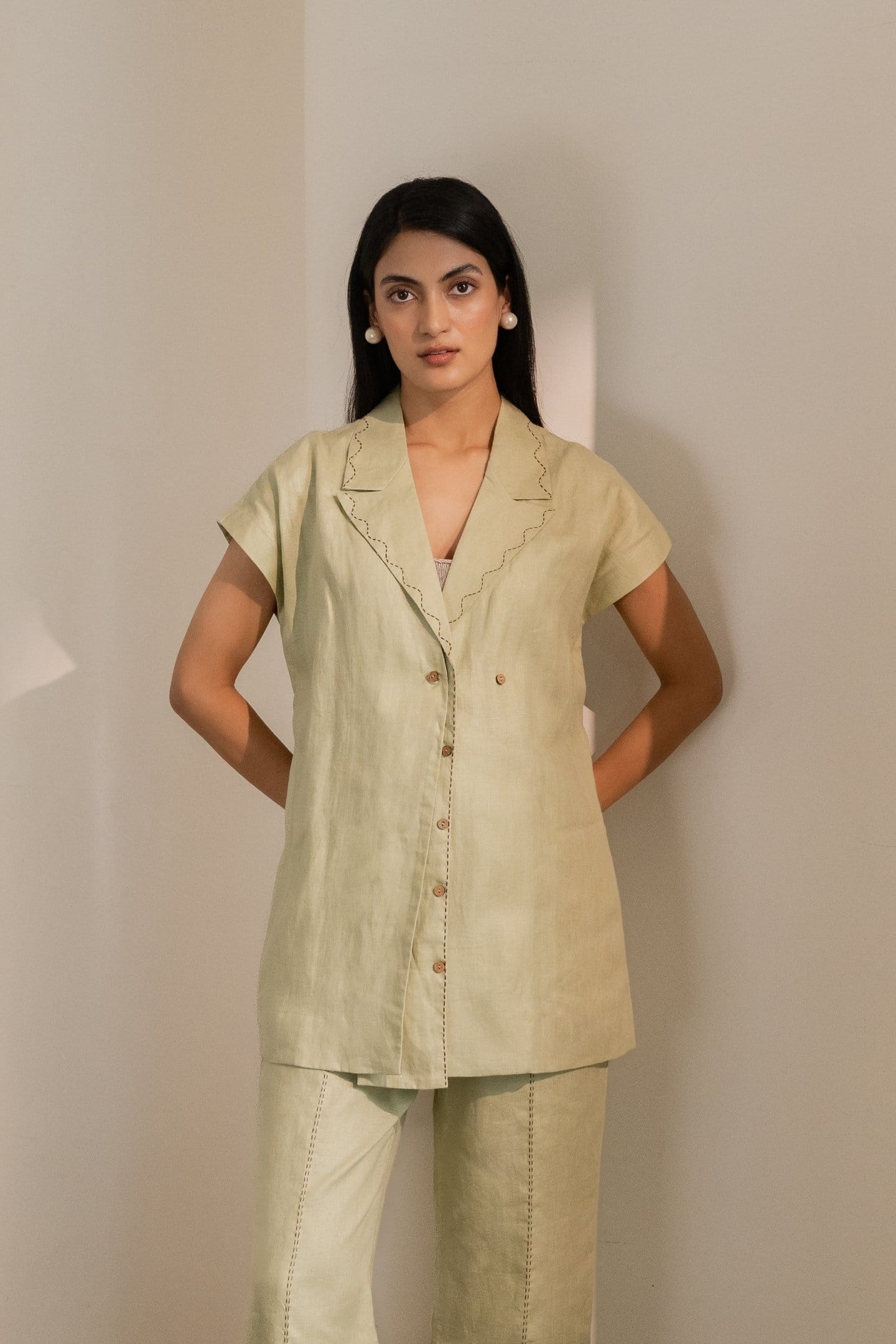Dew mint green Alternative blazer with tailored fit, featuring lapels and long sleeves, displayed on a hanger.