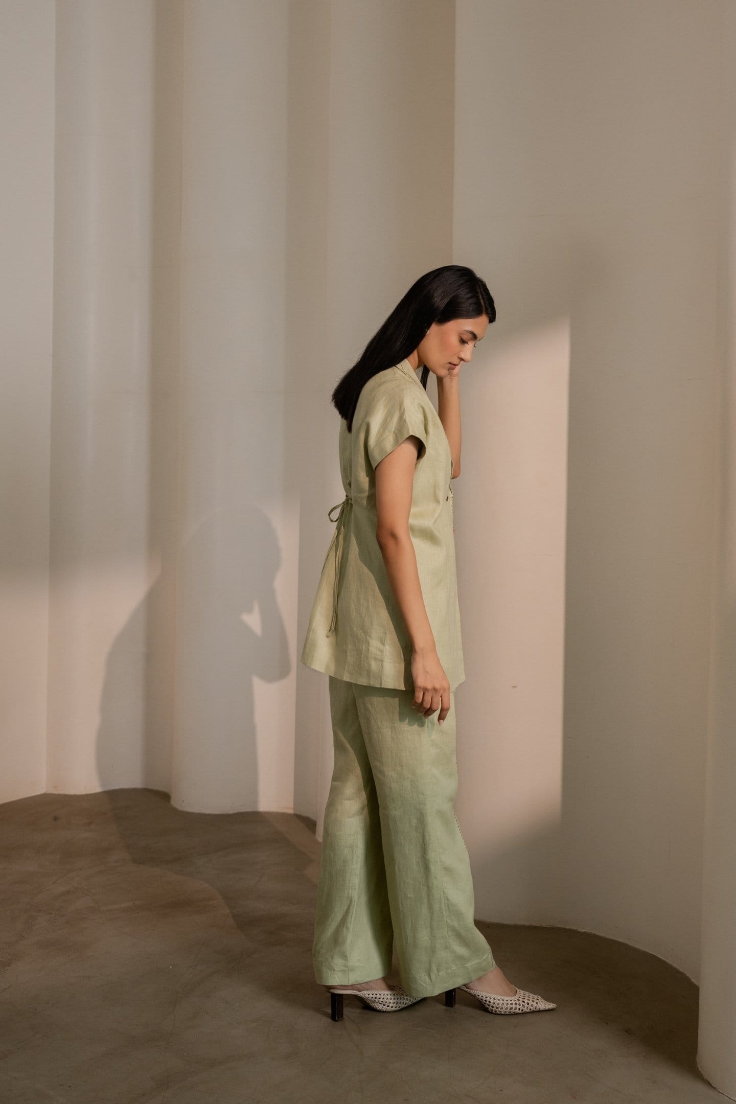 Mint green Dew trousers by Alternative, showing the stylish, tailored fit of the casual yet modern pants.