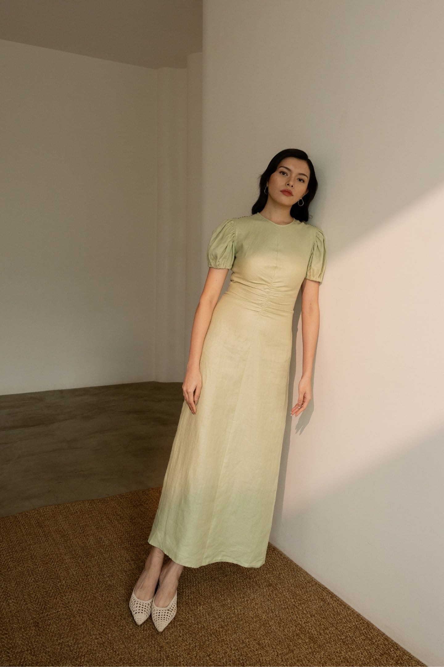 Dew mint green cinched maxi dress by Alternative, featuring a fitted waist and flowing fabric for a stylish, comfortable look.
