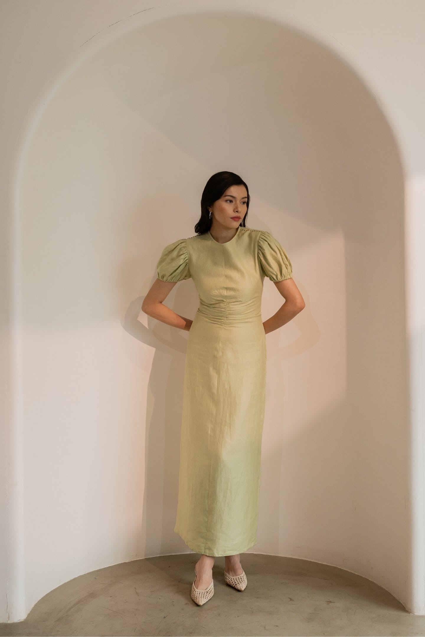 Dew mint green cinched maxi dress by Alternative, featuring a fitted waist and flowing fabric, perfect for casual or semi-formal wear.
