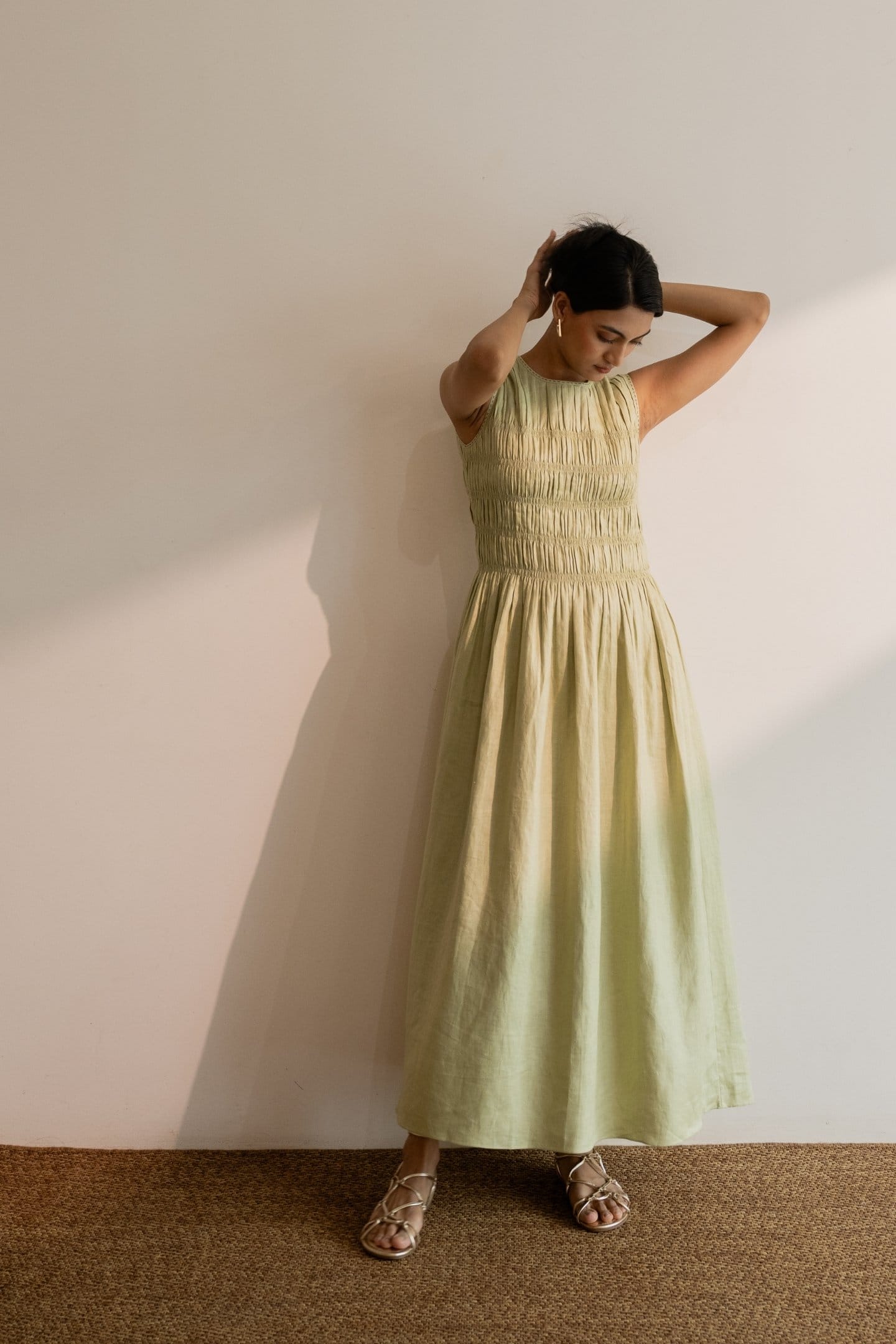 Dew mint green smocked maxi dress by Alternative, flowing fabric, fitted bodice, and adjustable shoulder straps.