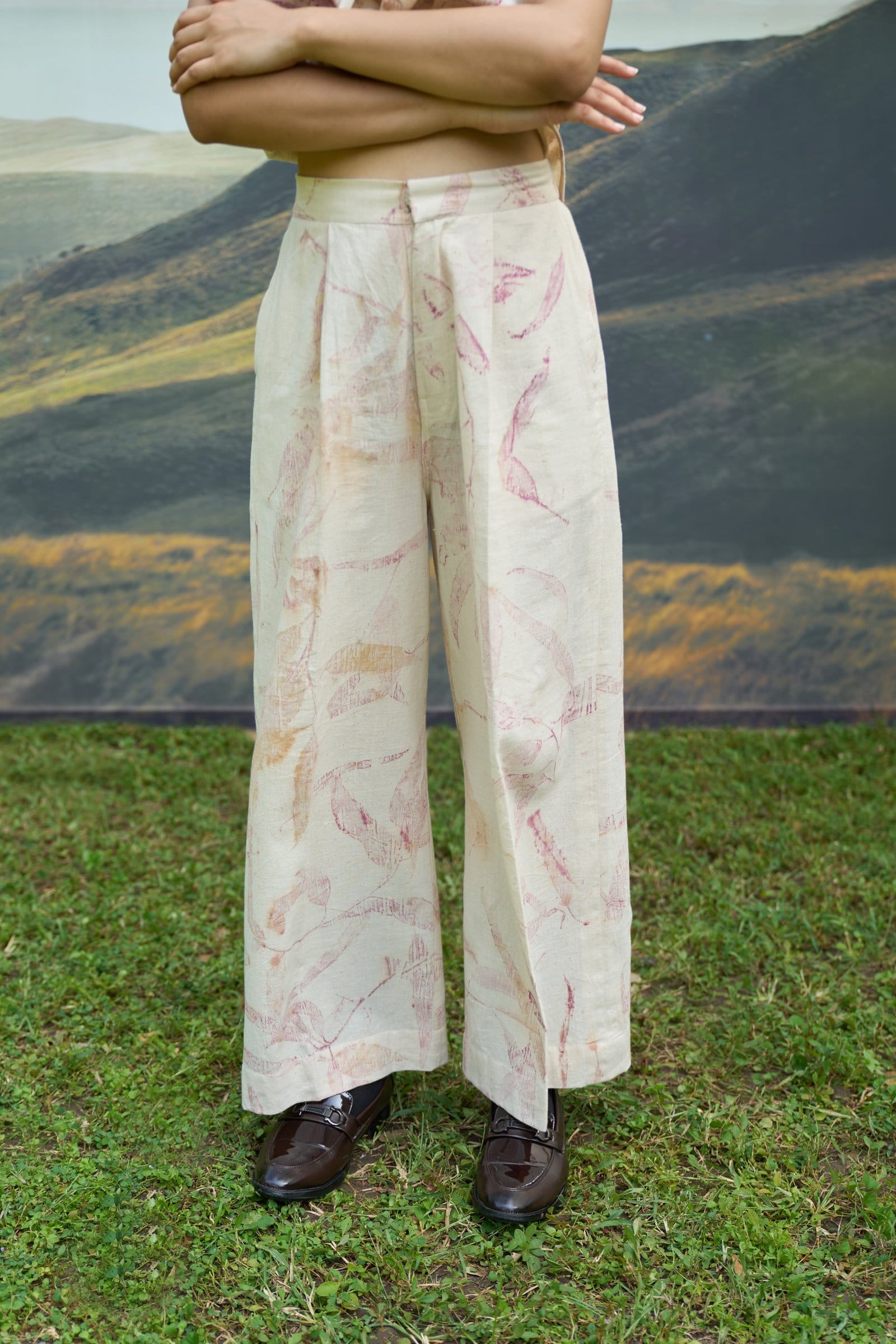 Pink foliage print top and flared trousers set by Alternative, featuring a stylish coordinated outfit with vibrant patterns and comfortable fit.