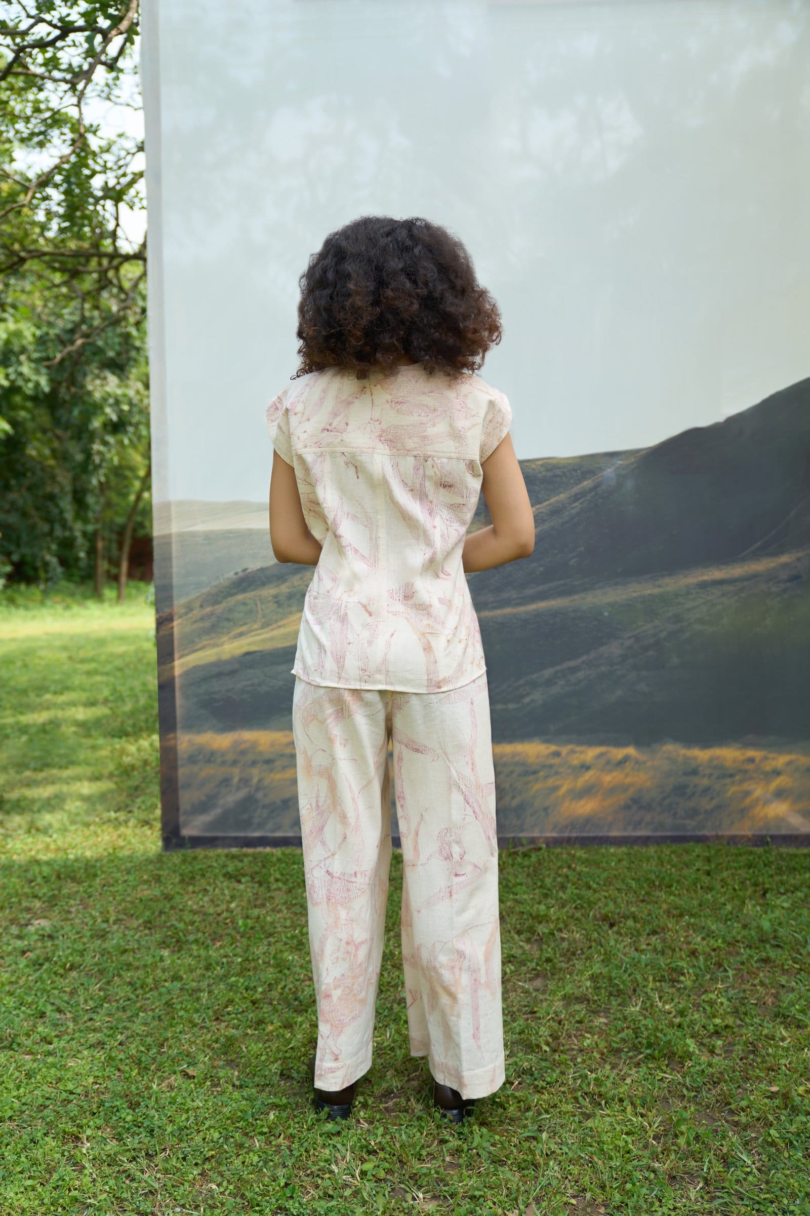 Pink foliage print top from Alternative, lightweight casual blouse with vibrant pink and green leaf pattern.