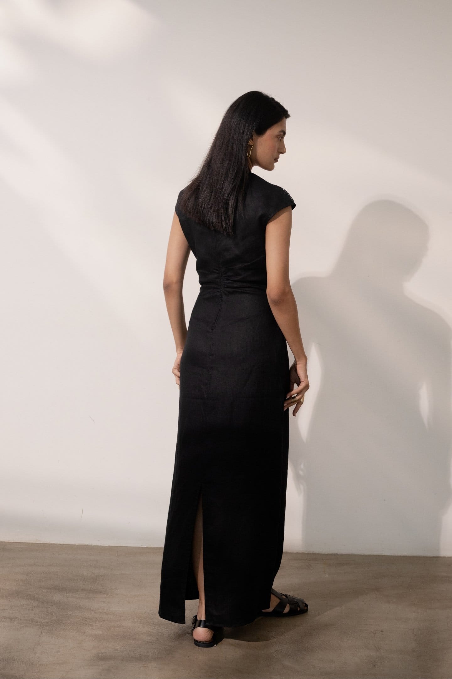 Ebony black maxi dress with cinched waist from Alternative, featuring a flowing silhouette and stylish design.