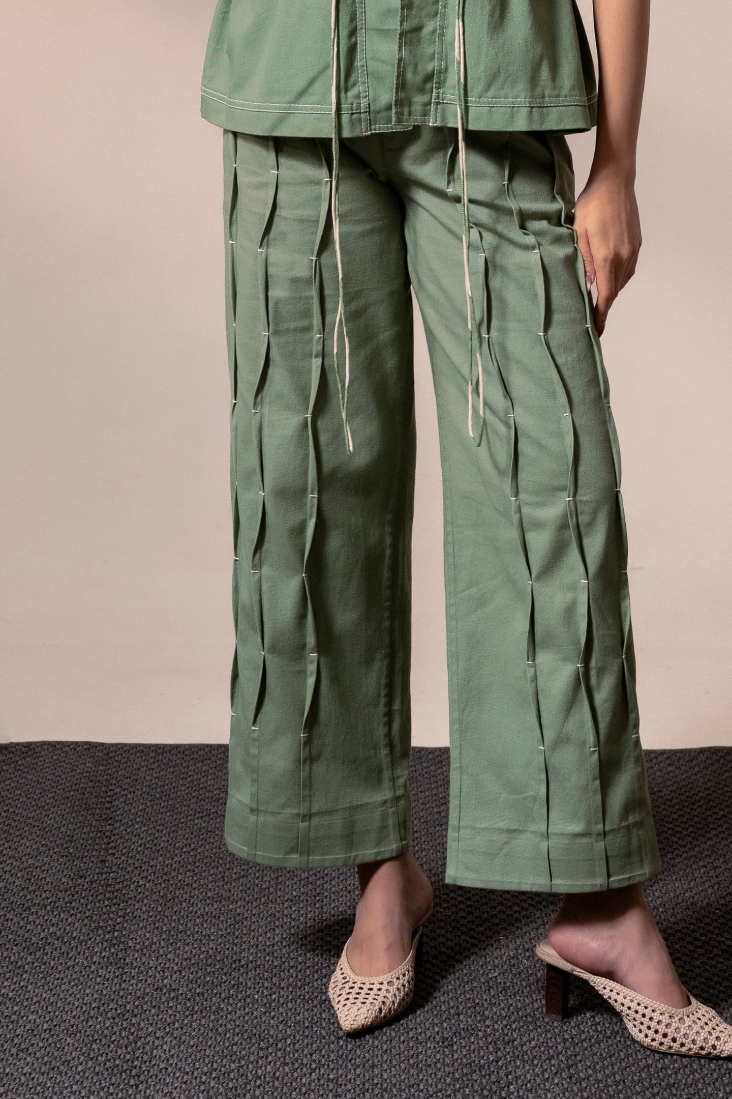 Fern green denim pleated trousers by Alternative, stylish high-waist pleated pants with a relaxed fit and classic denim texture.