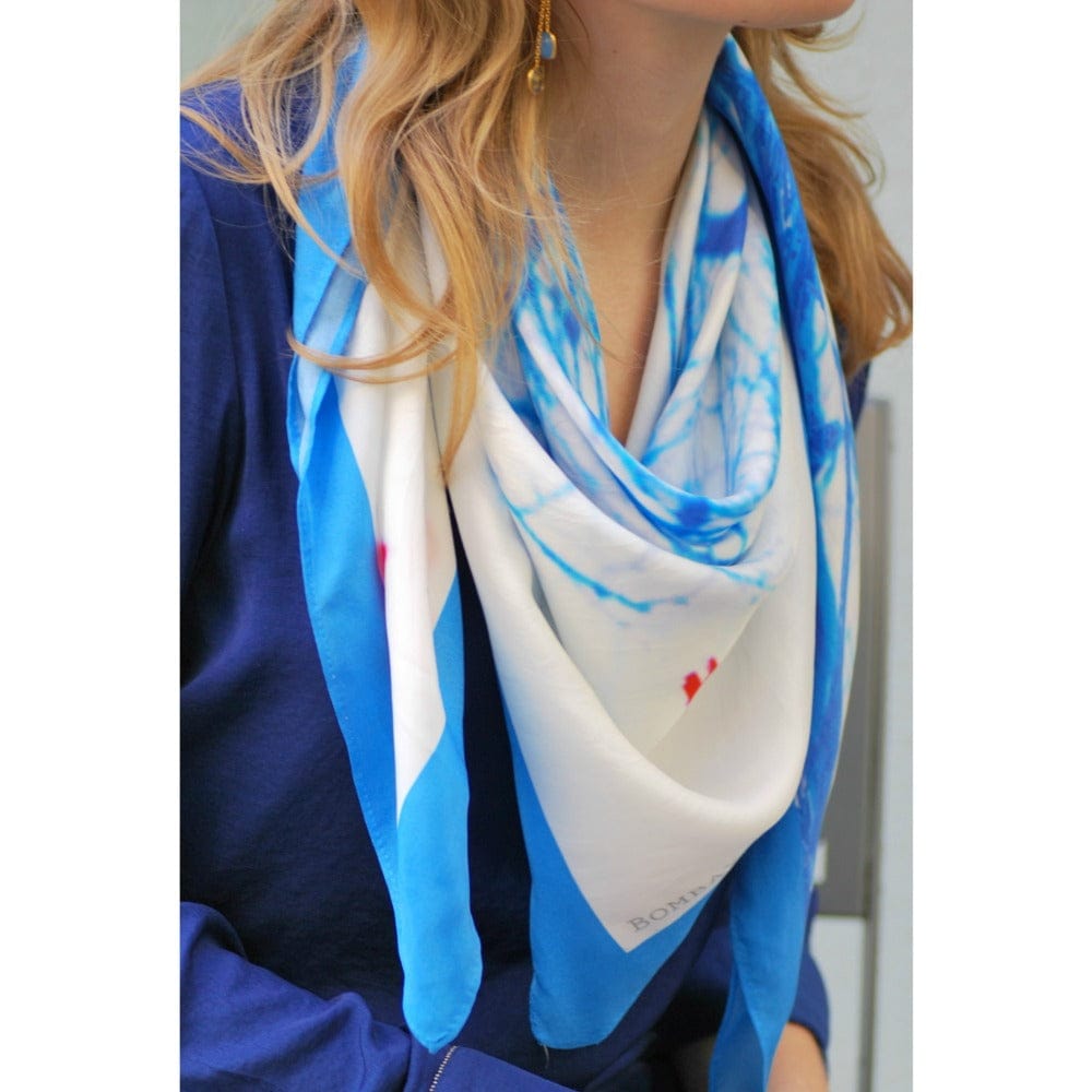 Colorful Bombaybirds Theflighttospring! scarf with floral and abstract patterns, soft fabric, and stylish design.