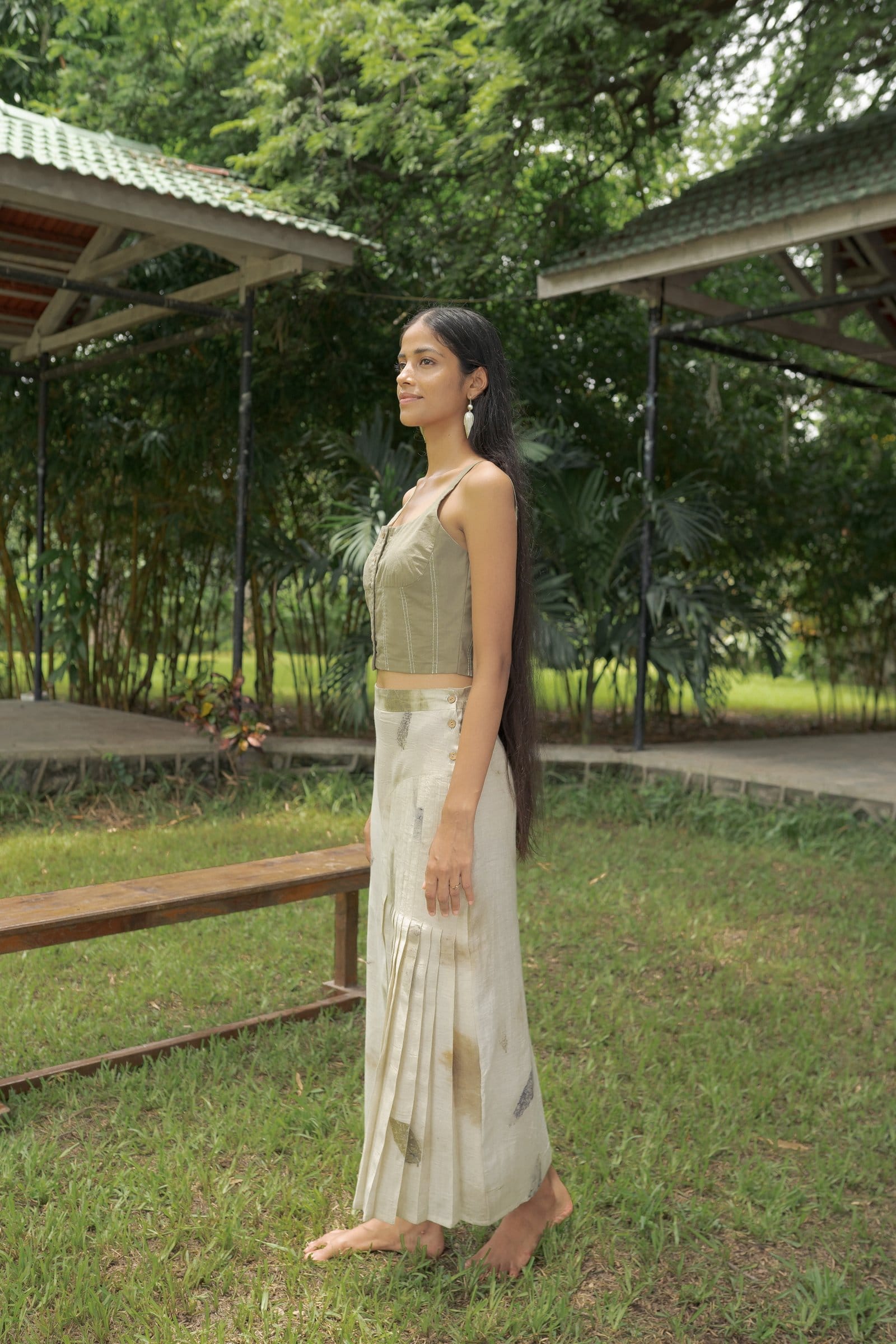 Alternative live leafy vest, a stylish green leafy print top from the clothing collection, shown on a mannequin.