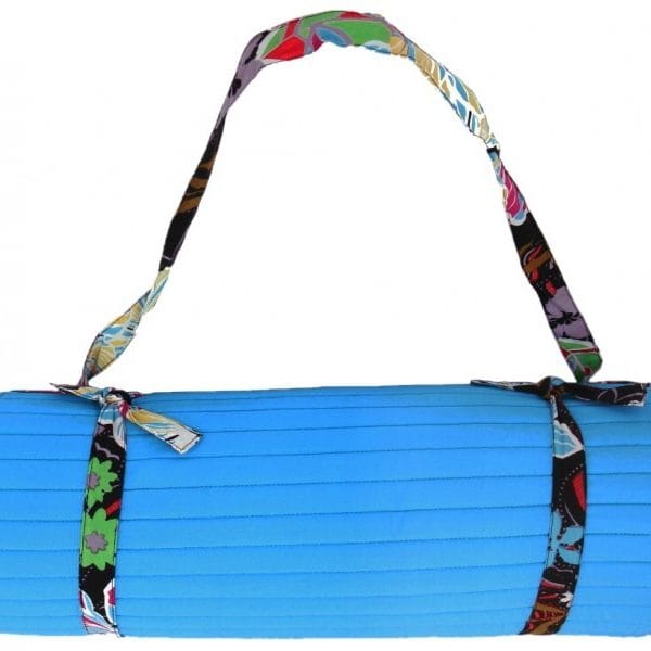 Turquoise hibiscus-themed beach mat by Bombaybirds with floral patterns, perfect for relaxing on the sand.