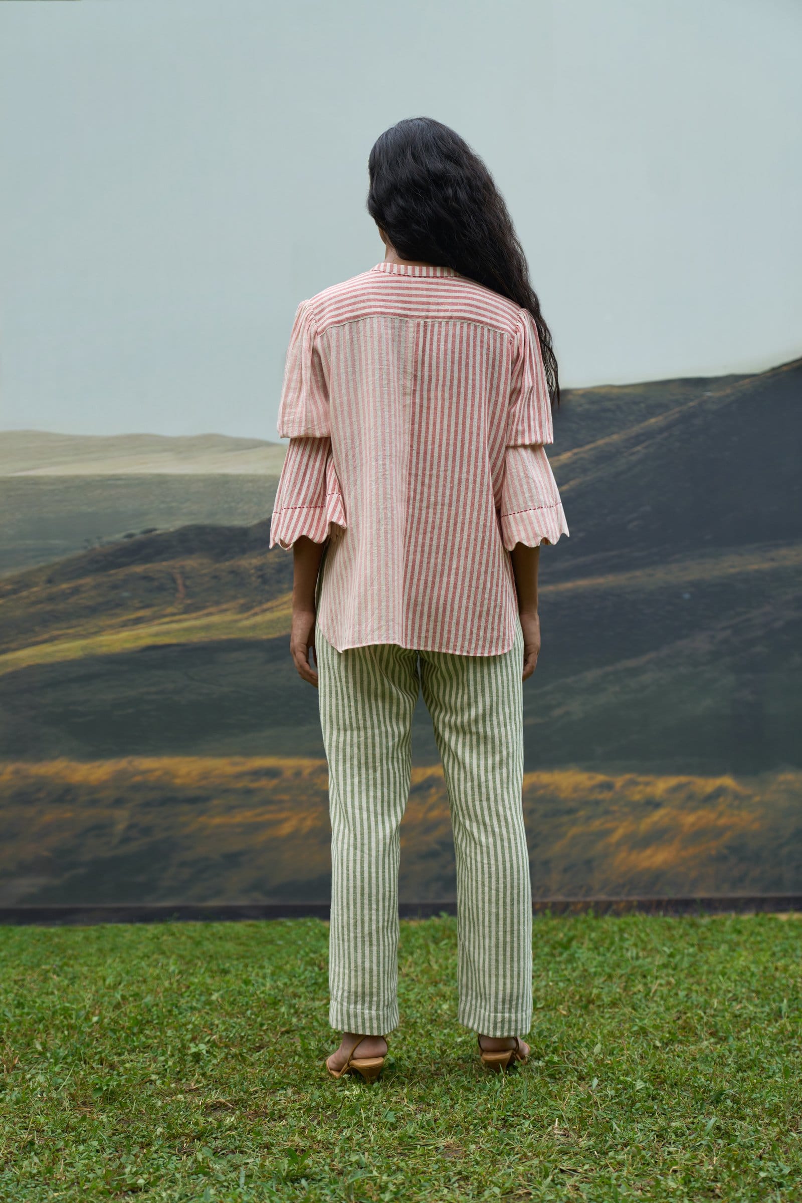 Scarlet top and moss green trousers from Alternative's coordinated set, featuring a stylish casual look.