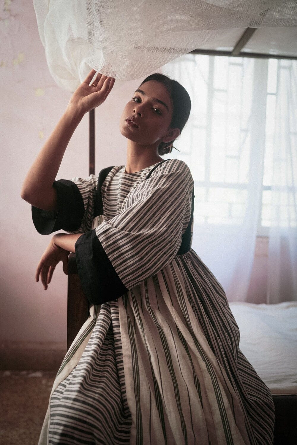 Deeta Shima dress featuring a stylish, flowing design with floral patterns and a comfortable fit, displayed on a hanger.