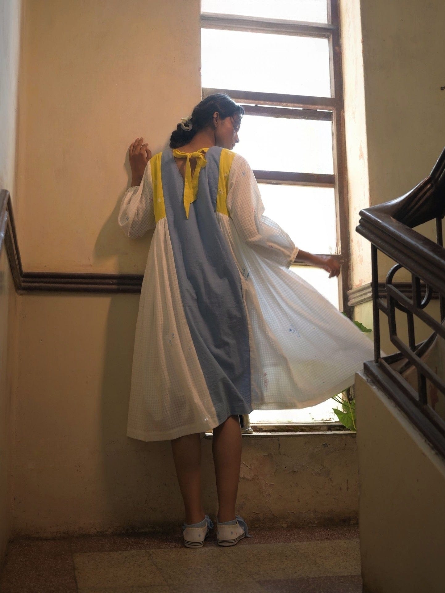 Deeta Kiku dress featuring a stylish, flowy design with floral patterns, perfect for casual or semi-formal occasions.