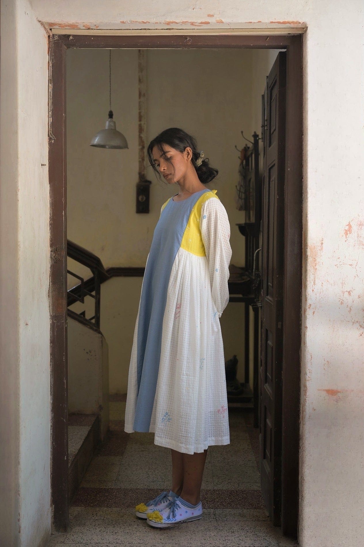 Deeta Kiku dress displayed with floral pattern and flowy fabric, showcasing elegant and stylish women's dress design.