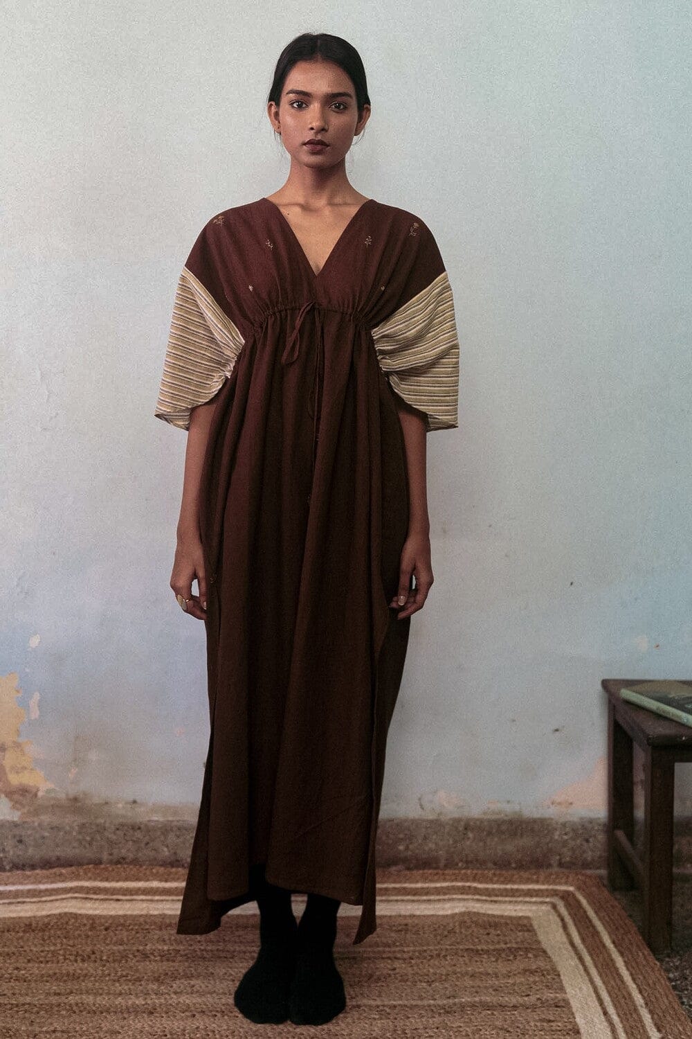 Deeta chairo kaftan dress featuring flowing fabric, intricate patterns, and a relaxed fit, perfect for casual or stylish occasions.