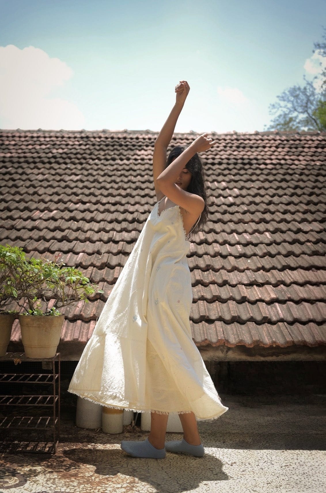 Deeta Hana slip dress in soft fabric, featuring a sleek silhouette and adjustable straps, perfect for casual or evening wear.
