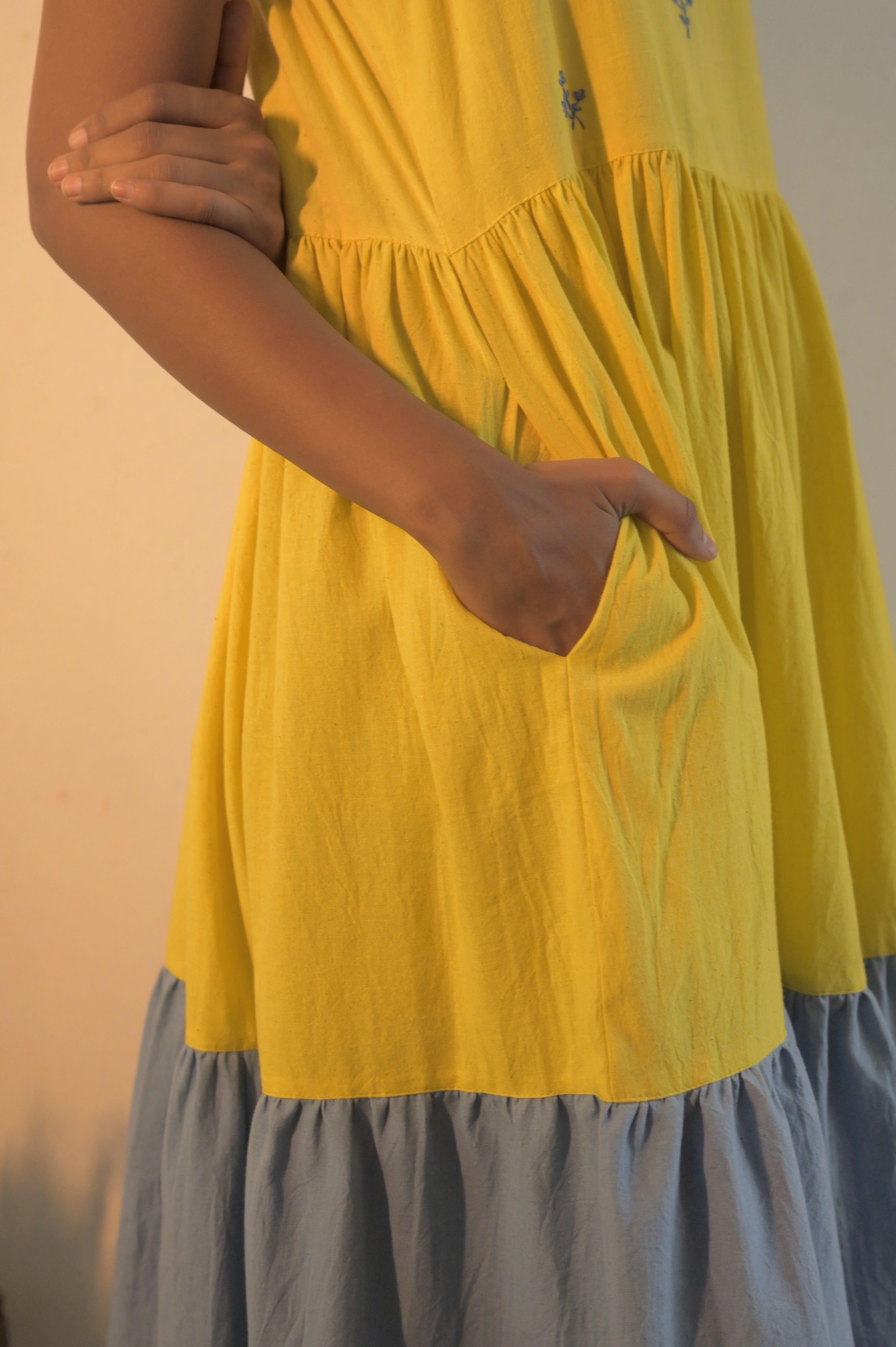 Deeta Kira slip dress in soft fabric with a sleek, minimalist design, featuring thin straps and a relaxed fit.