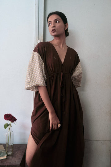 Deeta Chairo kaftan dress featuring flowing fabric, intricate patterns, and vibrant colors perfect for elegant summer wear.