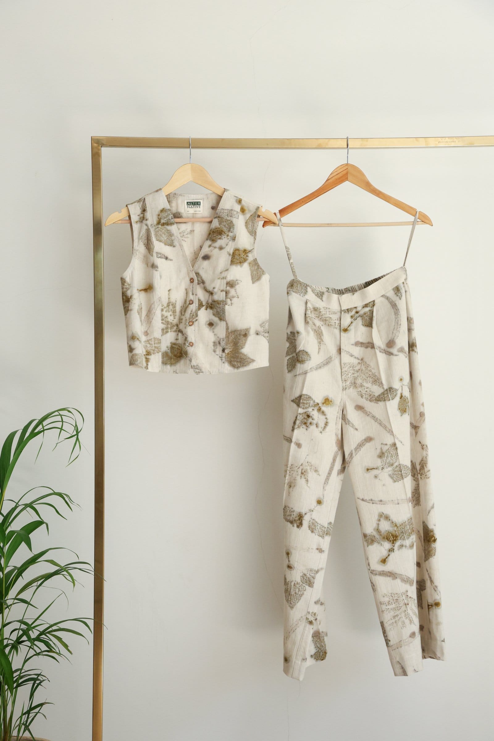 Alternative live leafy vest and pants coord set featuring a vibrant leafy print, perfect for casual or outdoor wear.
