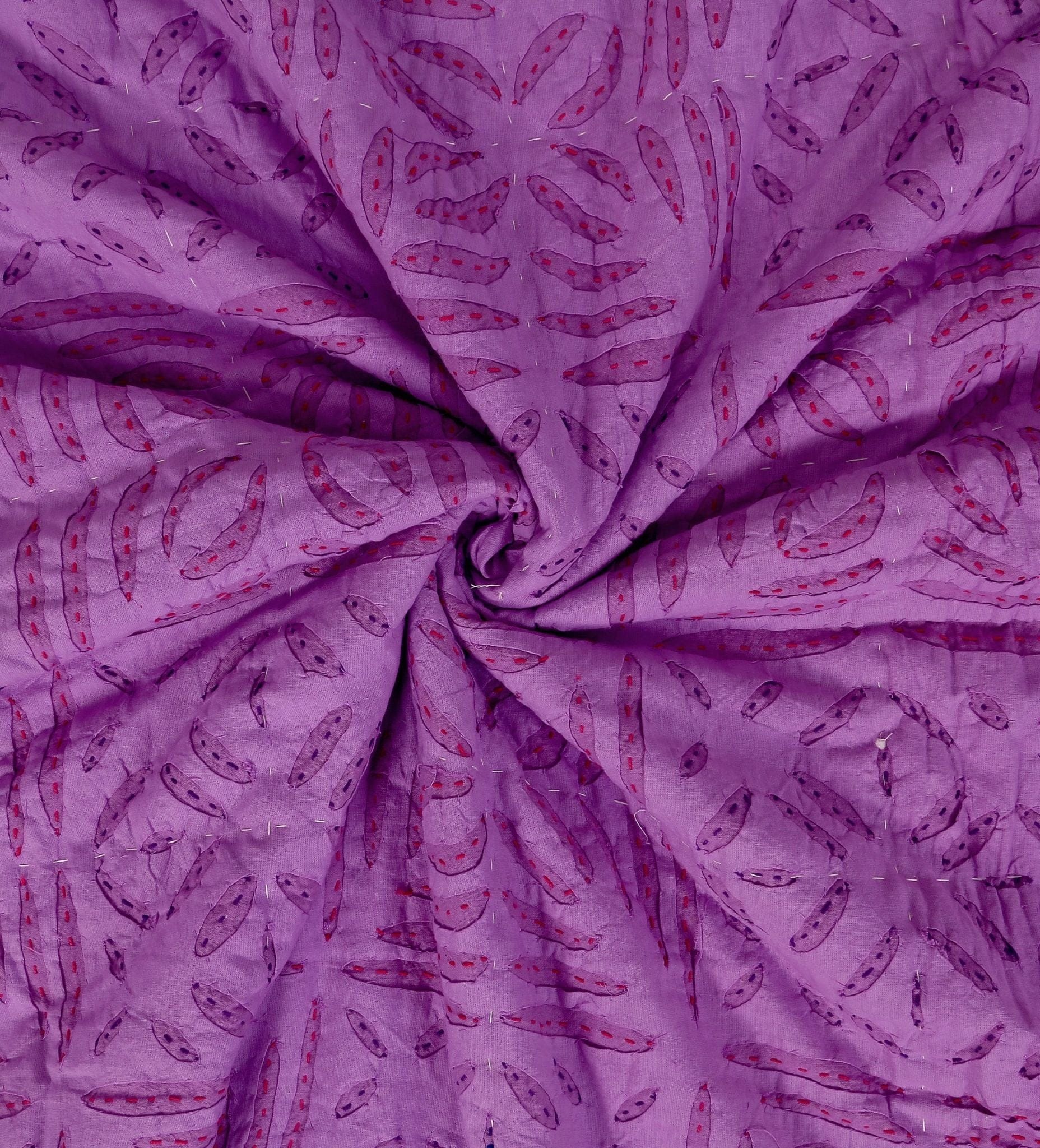 Handmade violet quilt applique from Bombaybirds, detailed close-up of intricate embroidery on soft fabric for living room decor.