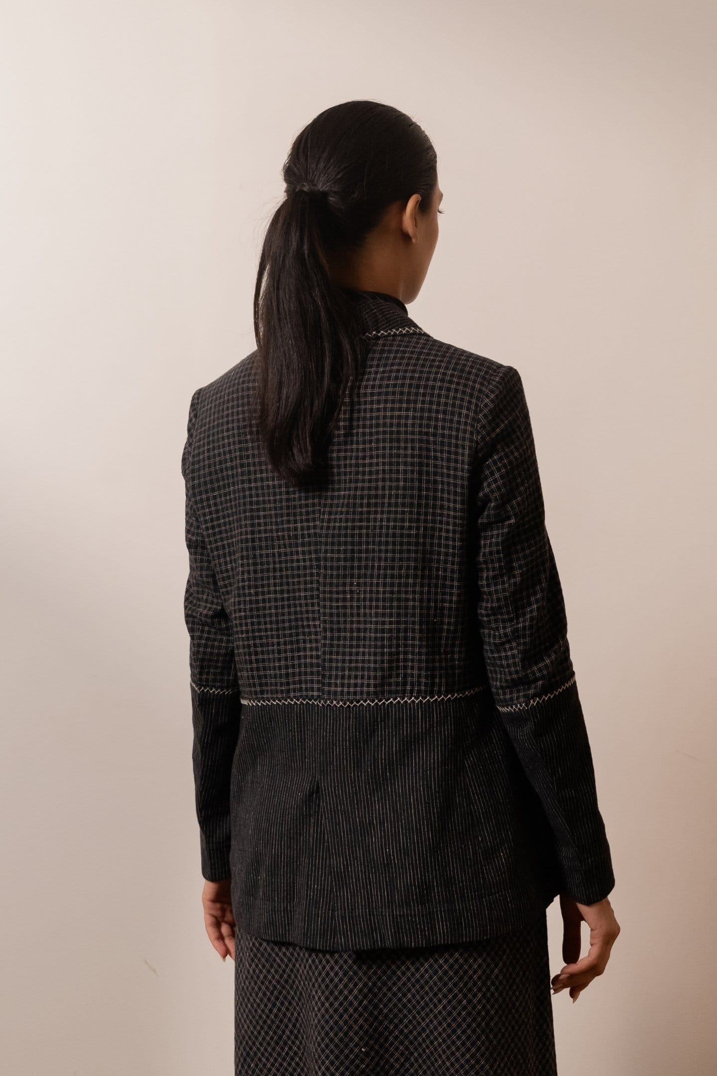 Alternative Lava Checks blazer in black and red check pattern, tailored fit with lapel collar and button closure.