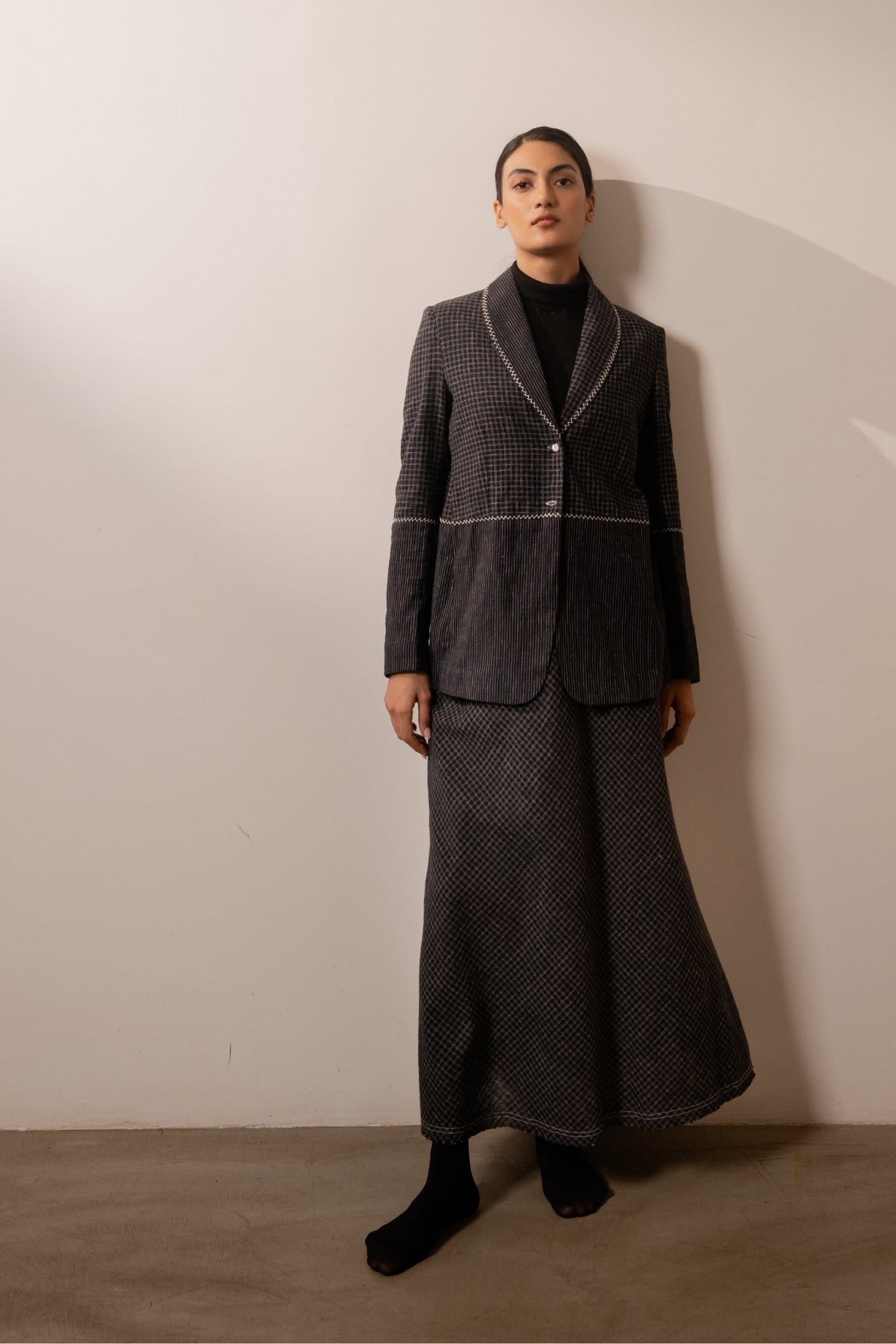 Black lava check blazer from Alternative with a tailored fit, featuring a classic check pattern and structured design.