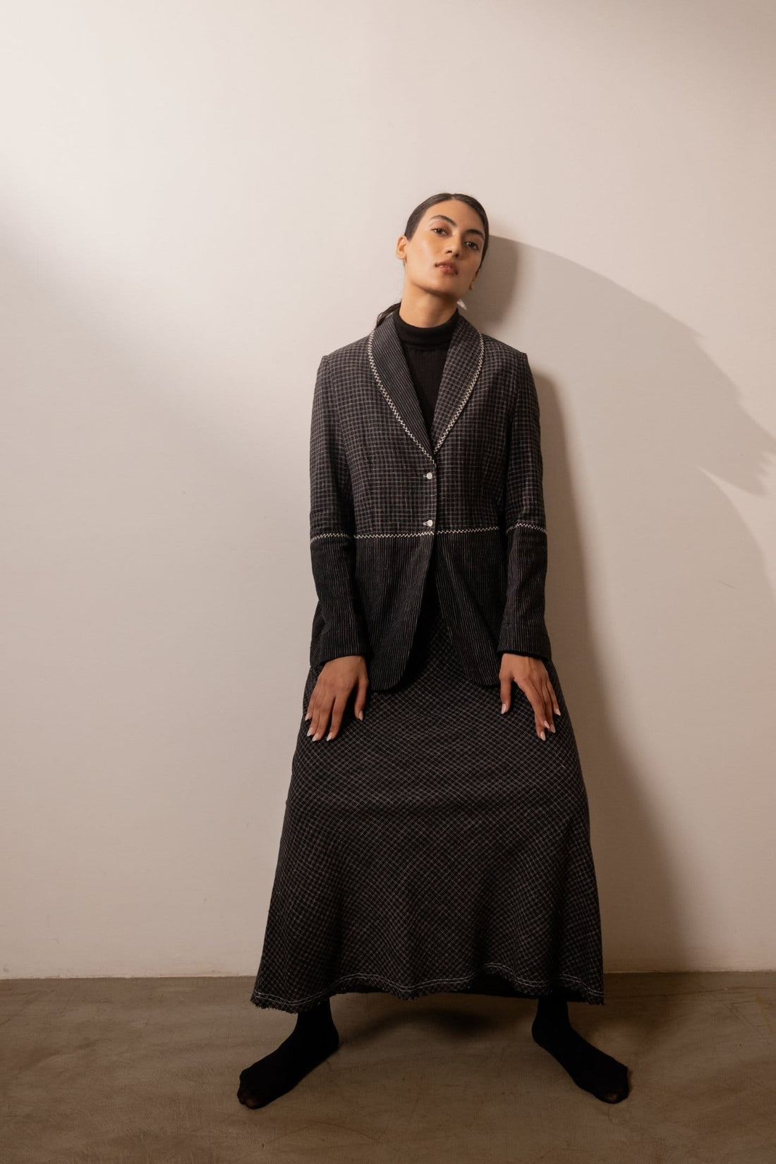 Black lava check blazer from Alternative with a tailored fit, featuring a classic check pattern and structured design.