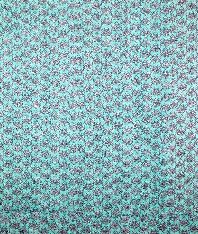 Pink Lotus reversible quilt by Bombaybirds featuring vibrant turquoise block print and intricate Indian handwork.