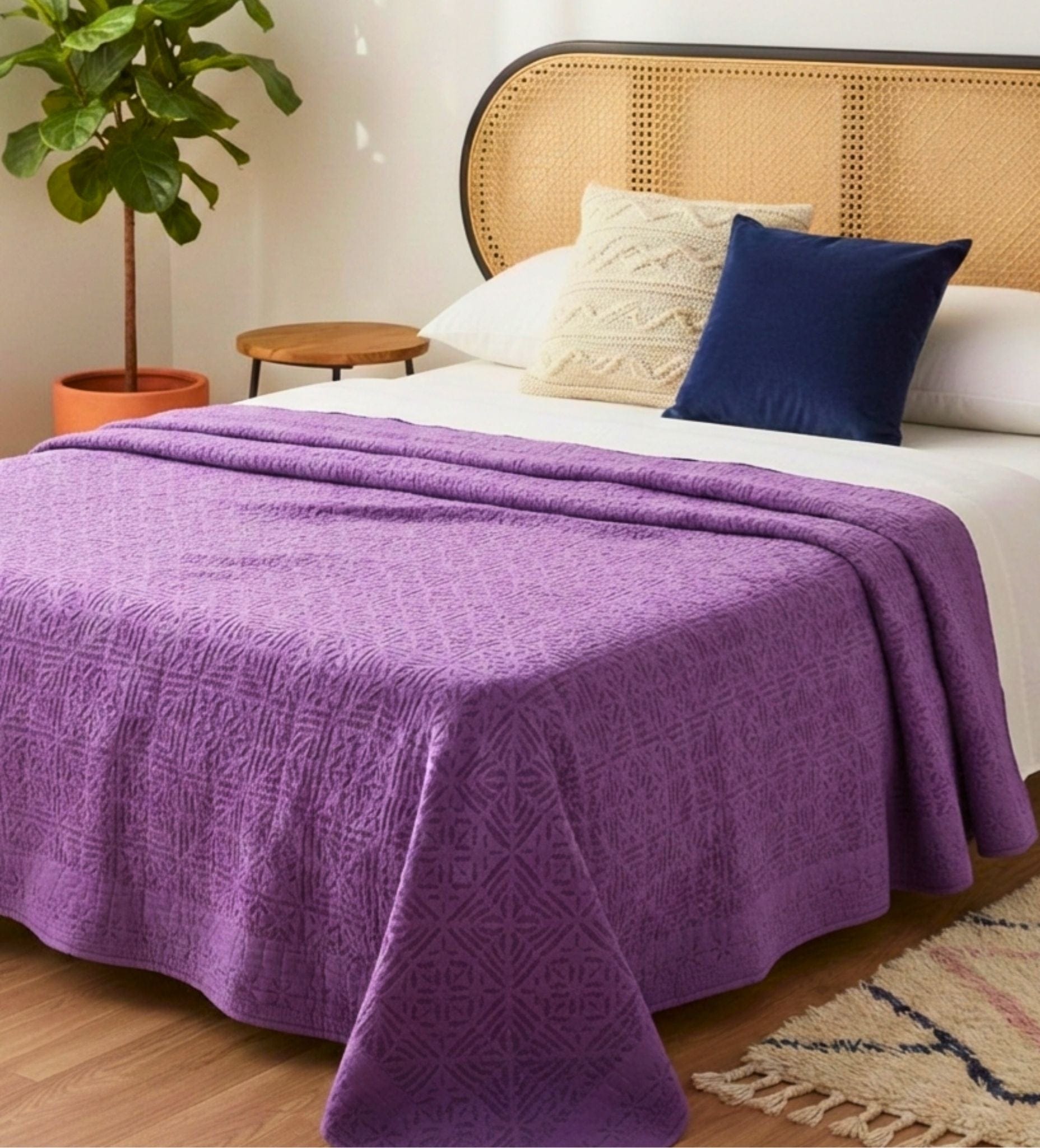 Bombaybirds violet quilt applique with luxurious purple cotton fabric, perfect for a cozy bedroom decor.