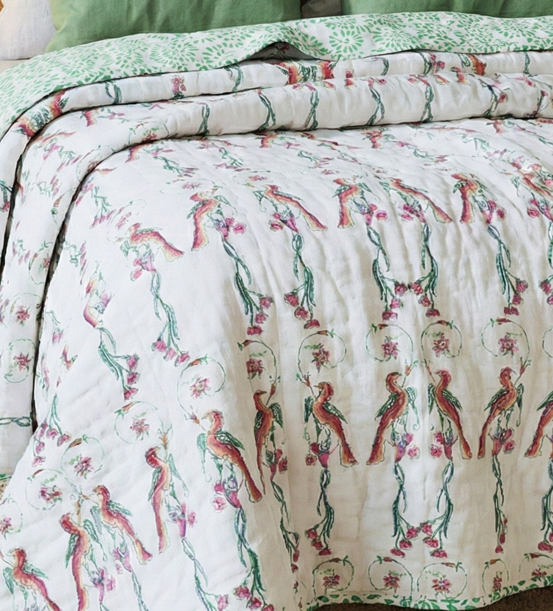 Reversible Ornitho blanket by Bombaybirds featuring vibrant bird and floral blockprint design, perfect for living room decor.