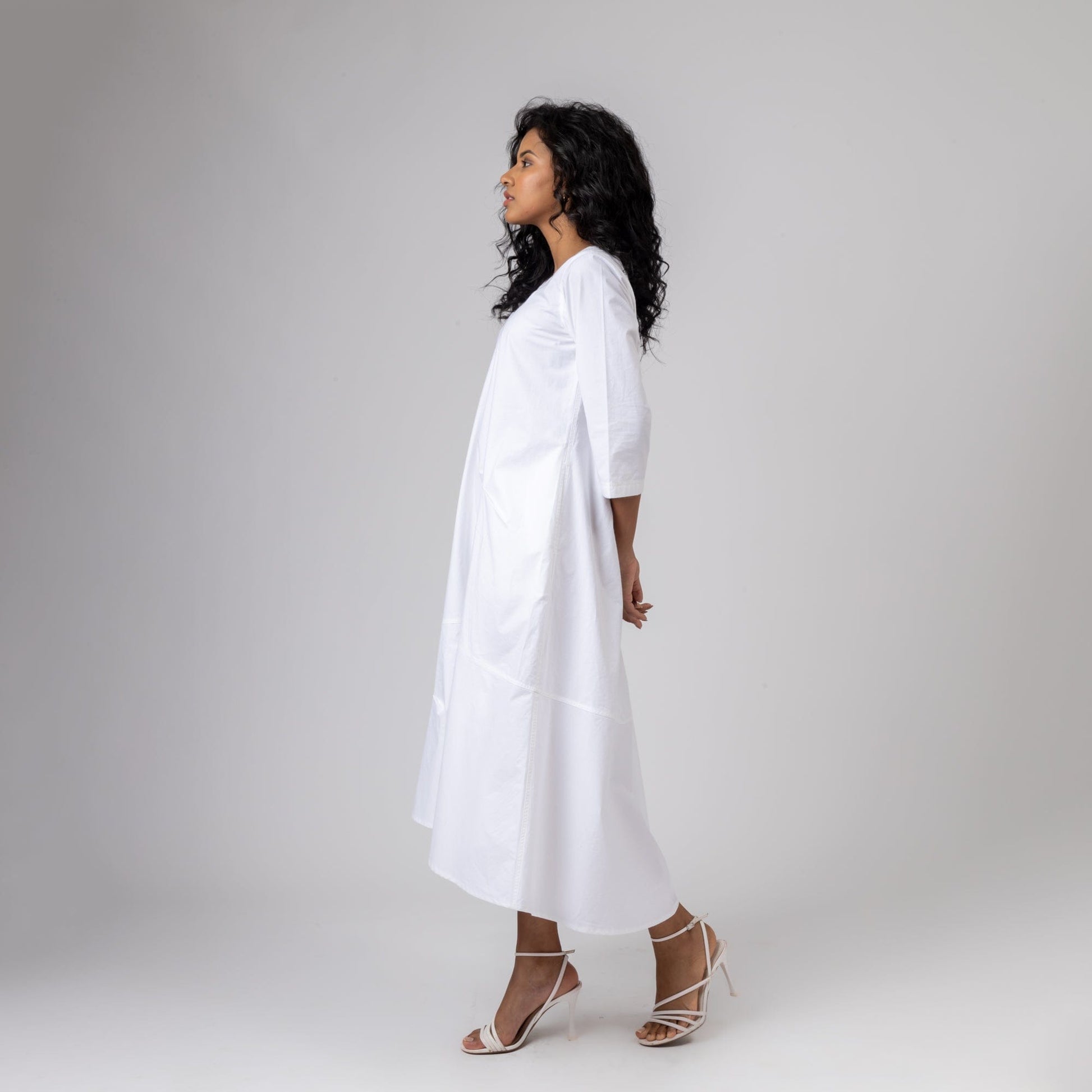 White Jill dress by Doodlage featuring a chic, flowing design with subtle detailing, perfect for casual or semi-formal occasions.