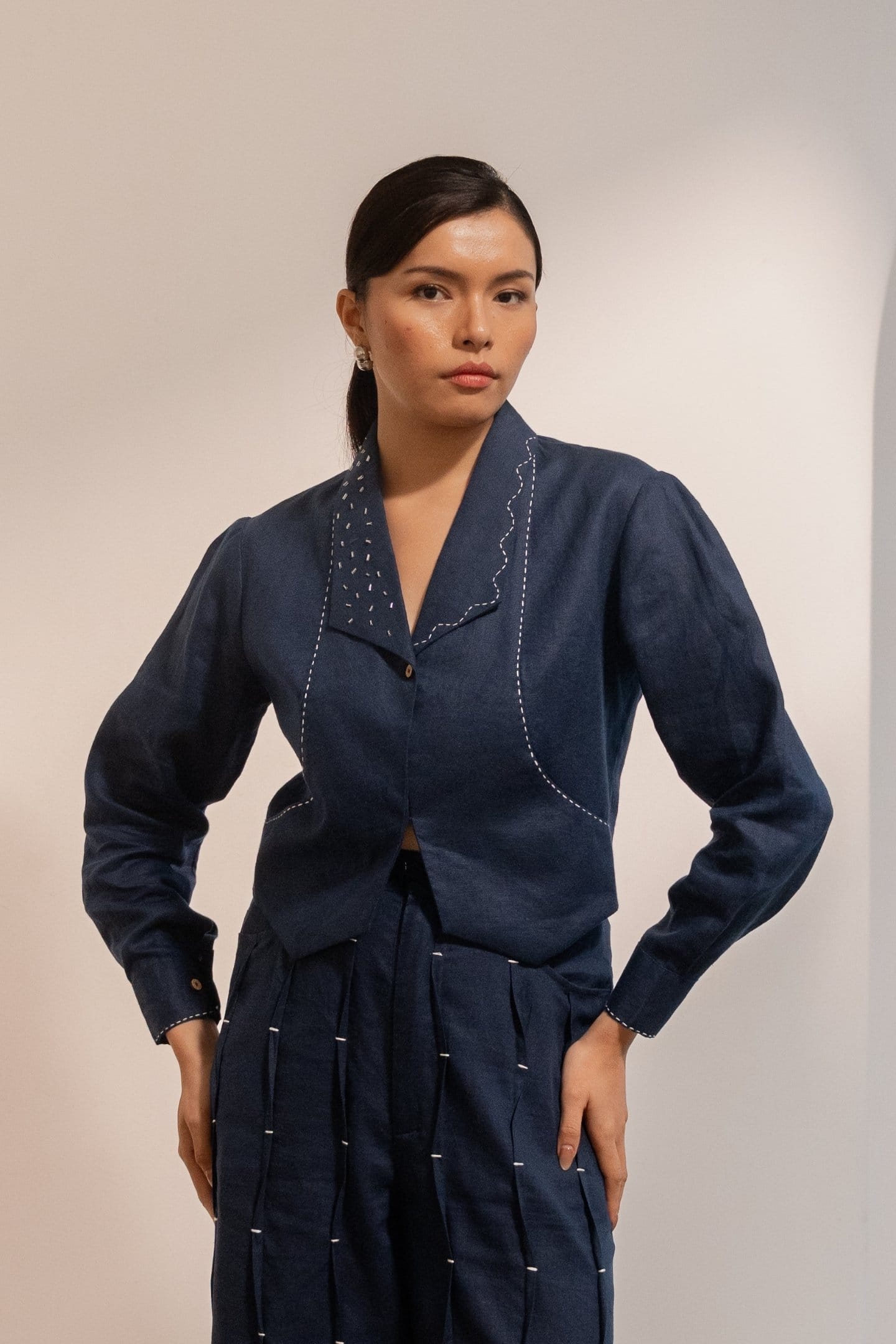 Navy blue Moraine crop blazer from Alternative with a tailored fit, featuring a classic collar and button closure.