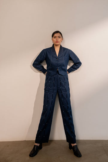 Navy blue Moraine crop blazer by Alternative, styled with matching pants, showcasing tailored fit and lightweight fabric.