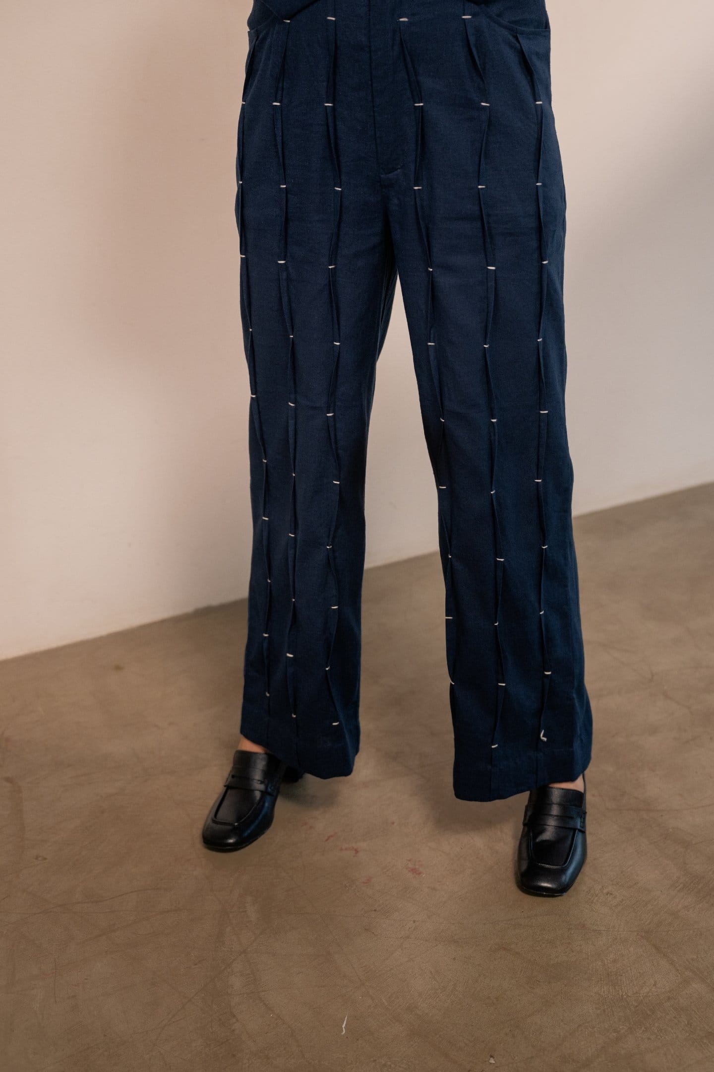 Navy blue Moraine pleated trousers by Alternative, stylish men's trousers with a tailored fit and pleated front design.