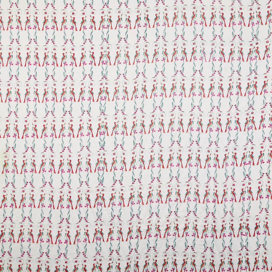 Reversible Ornitho blanket by Bombaybirds featuring bird and block print designs on soft cotton, hand-finished for living room decor.