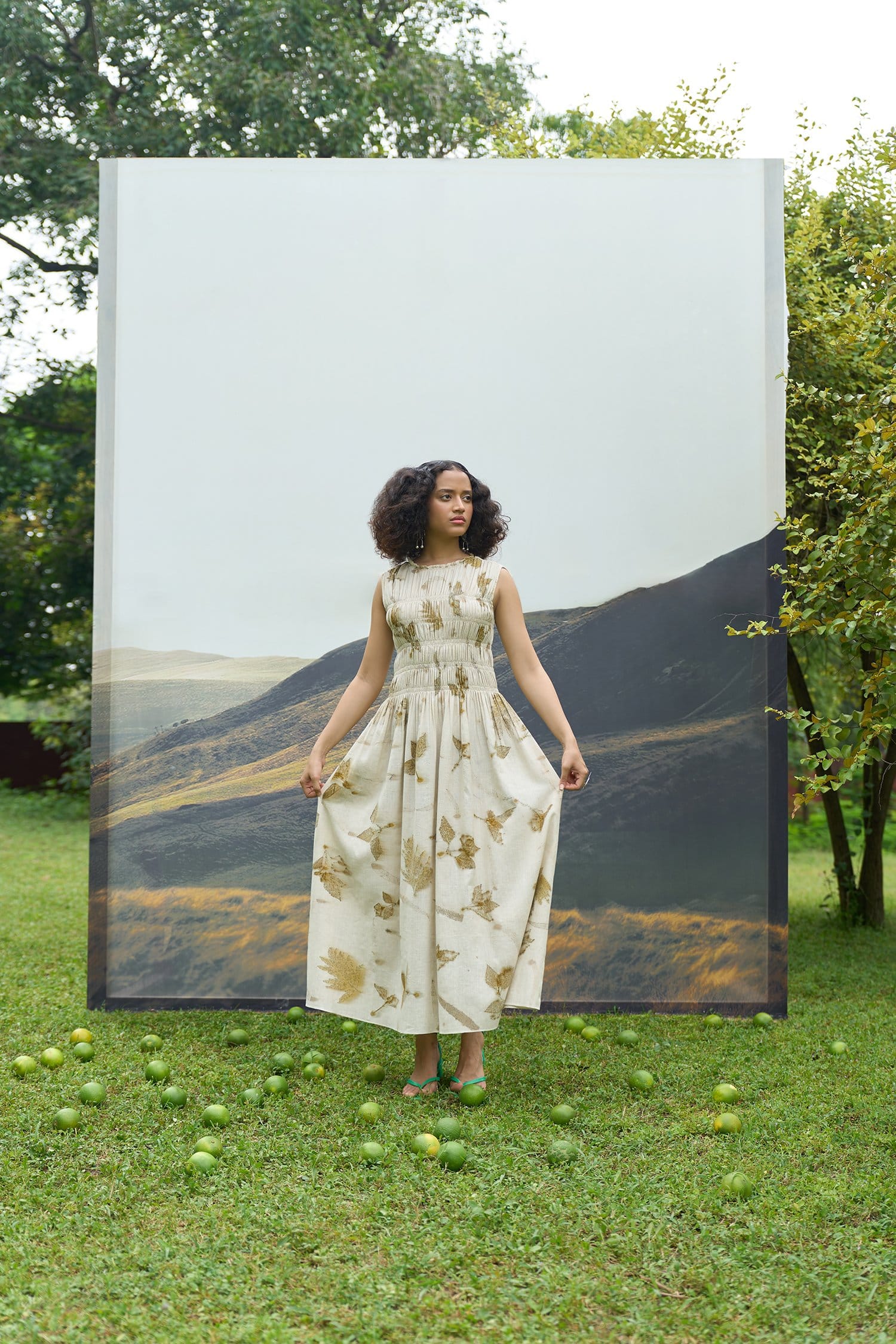 Alternative live leafy bell dress, short dress with a vibrant leafy pattern, displayed on a mannequin.