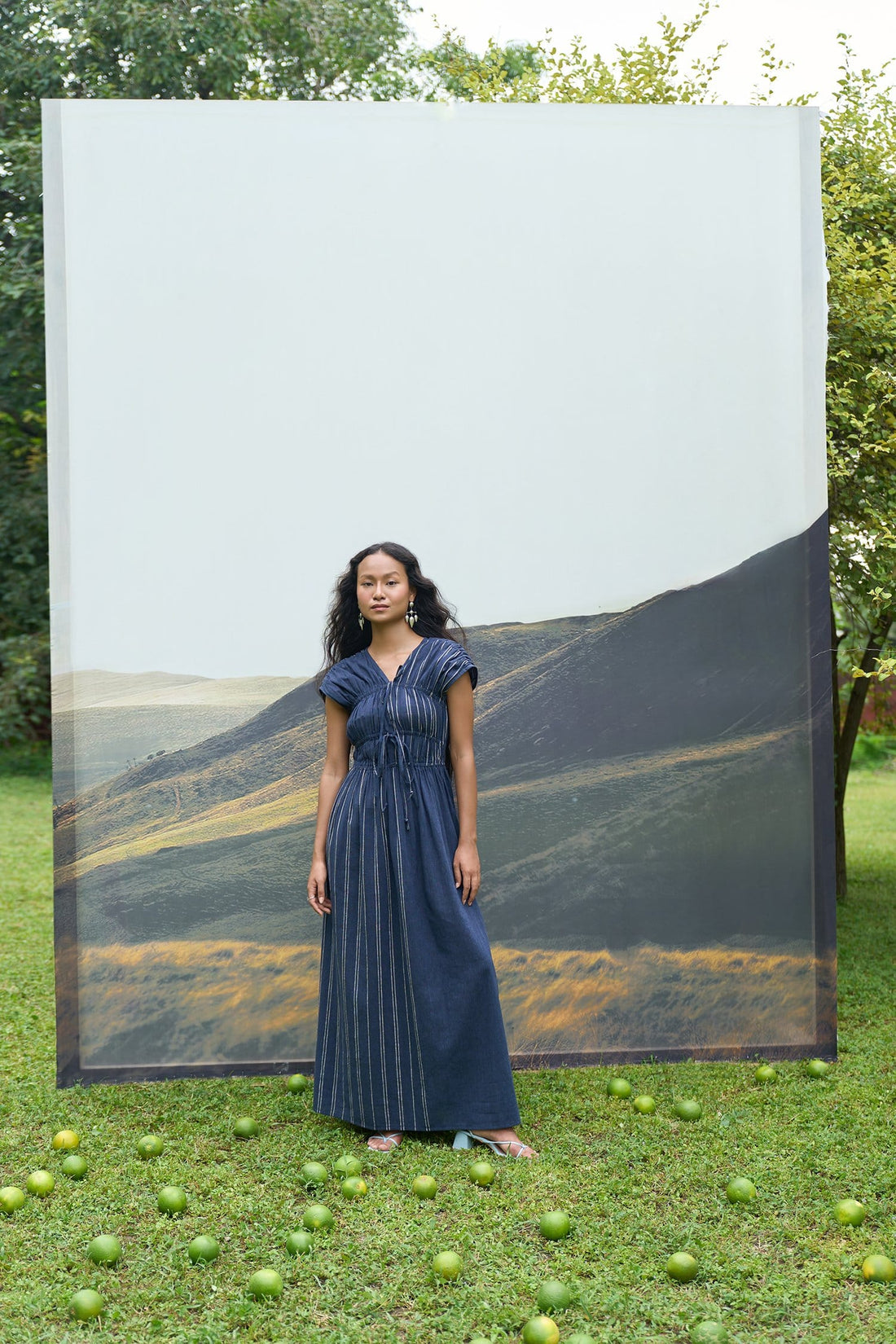 Alternative cobalt maxi dress with tie-up front and flowing fabric, styled as a stylish summer or evening dress.