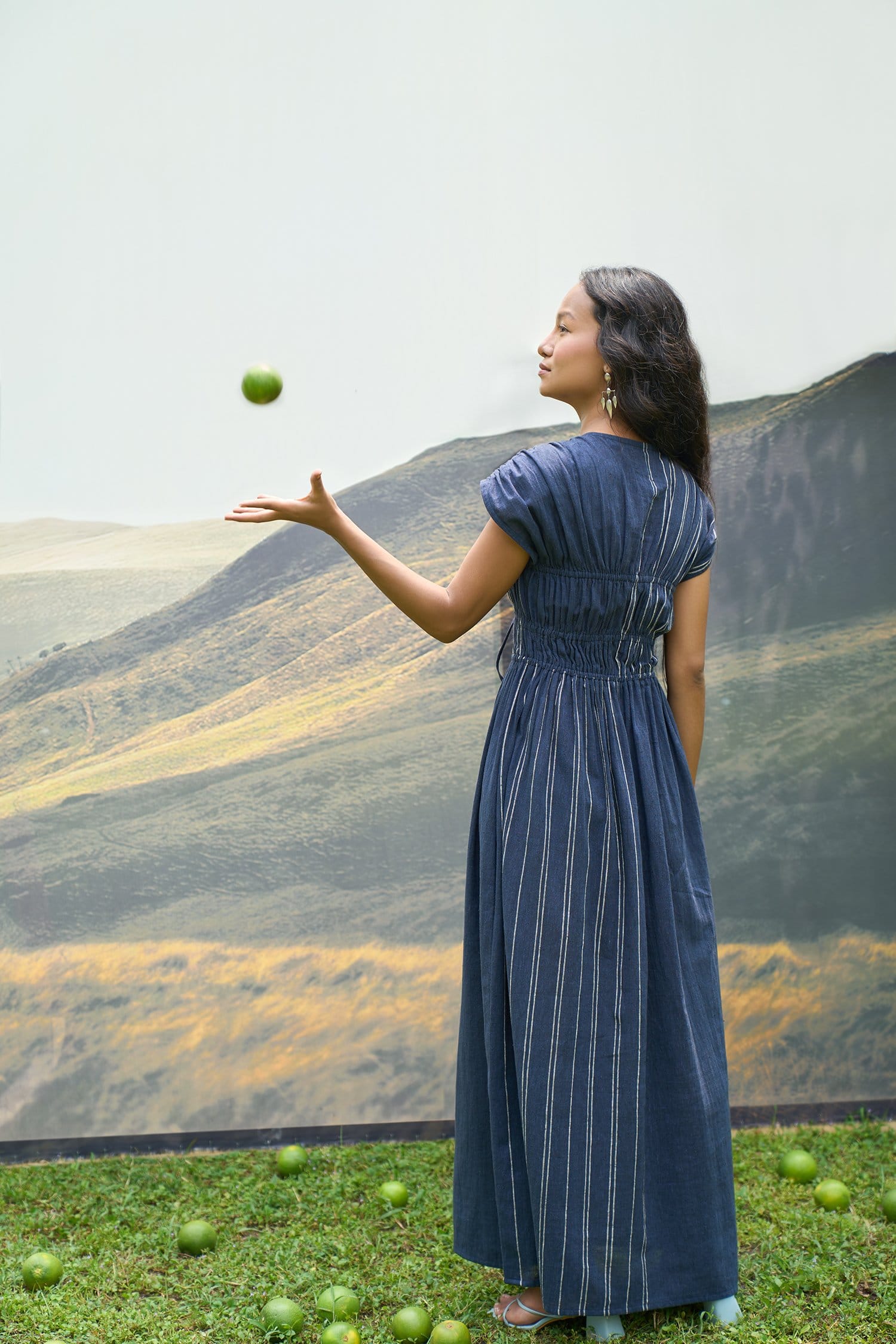 Cobalt blue Alternative maxi dress with tie-up waist and flowing fabric, displayed on a mannequin against a neutral background.
