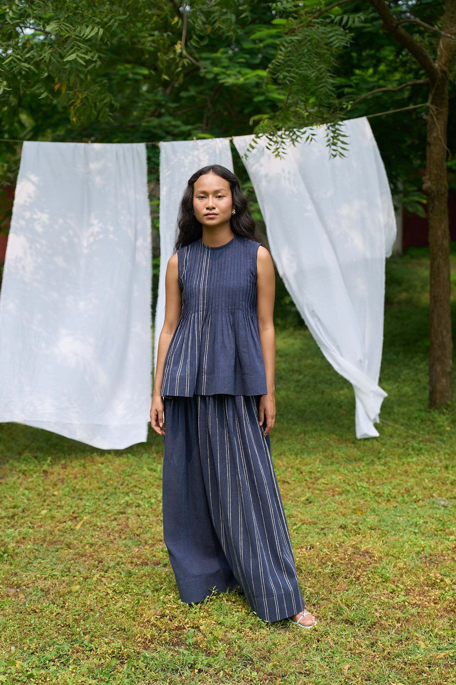 Cobalt sleeveless pintucks top by Alternative, showing front view with detailed pintuck design and sleeveless style.