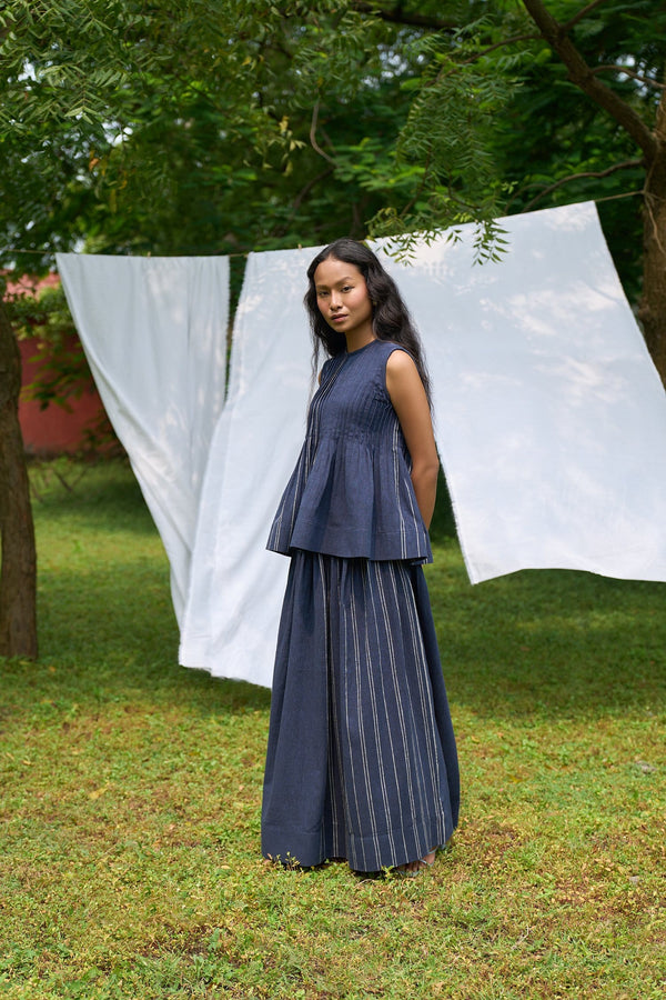 Cobalt sleeveless pintucks top and skirt set by Alternative, featuring a coordinated fashion ensemble with a sleeveless design.
