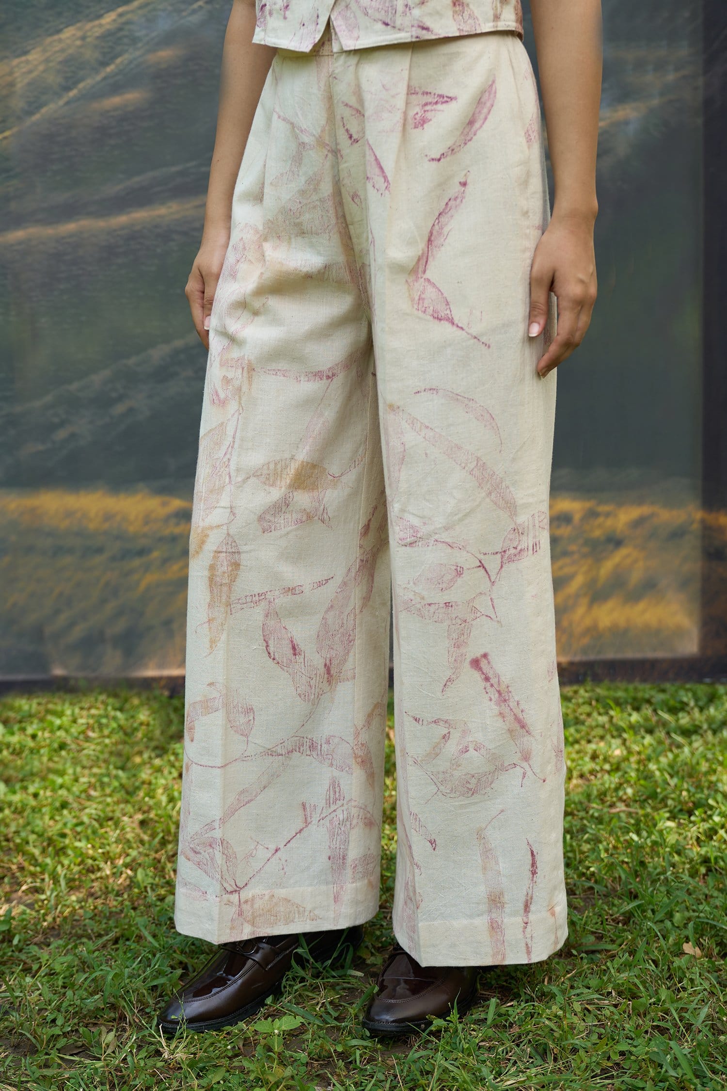 Pink foliage vest from Alternative, a stylish top featuring vibrant pink leaf patterns on soft fabric.