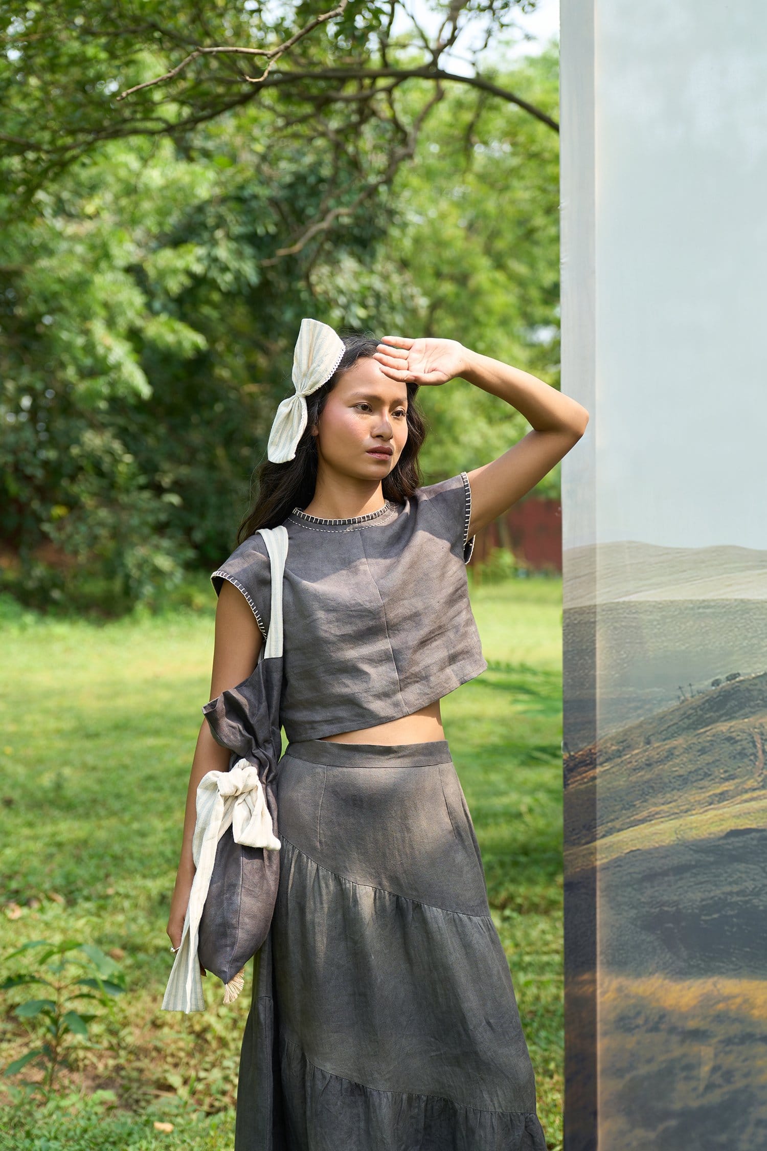 Willow tiered skirt by Alternative showing its layered fabric design and flowy silhouette in soft, neutral tones.